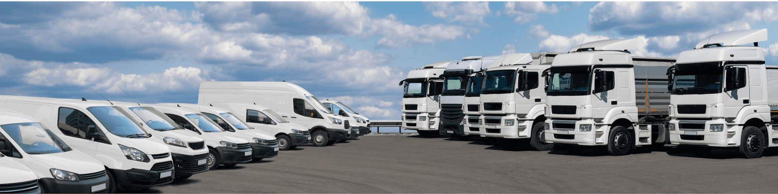 a wide angle photo of a fleet of vans and trucks
