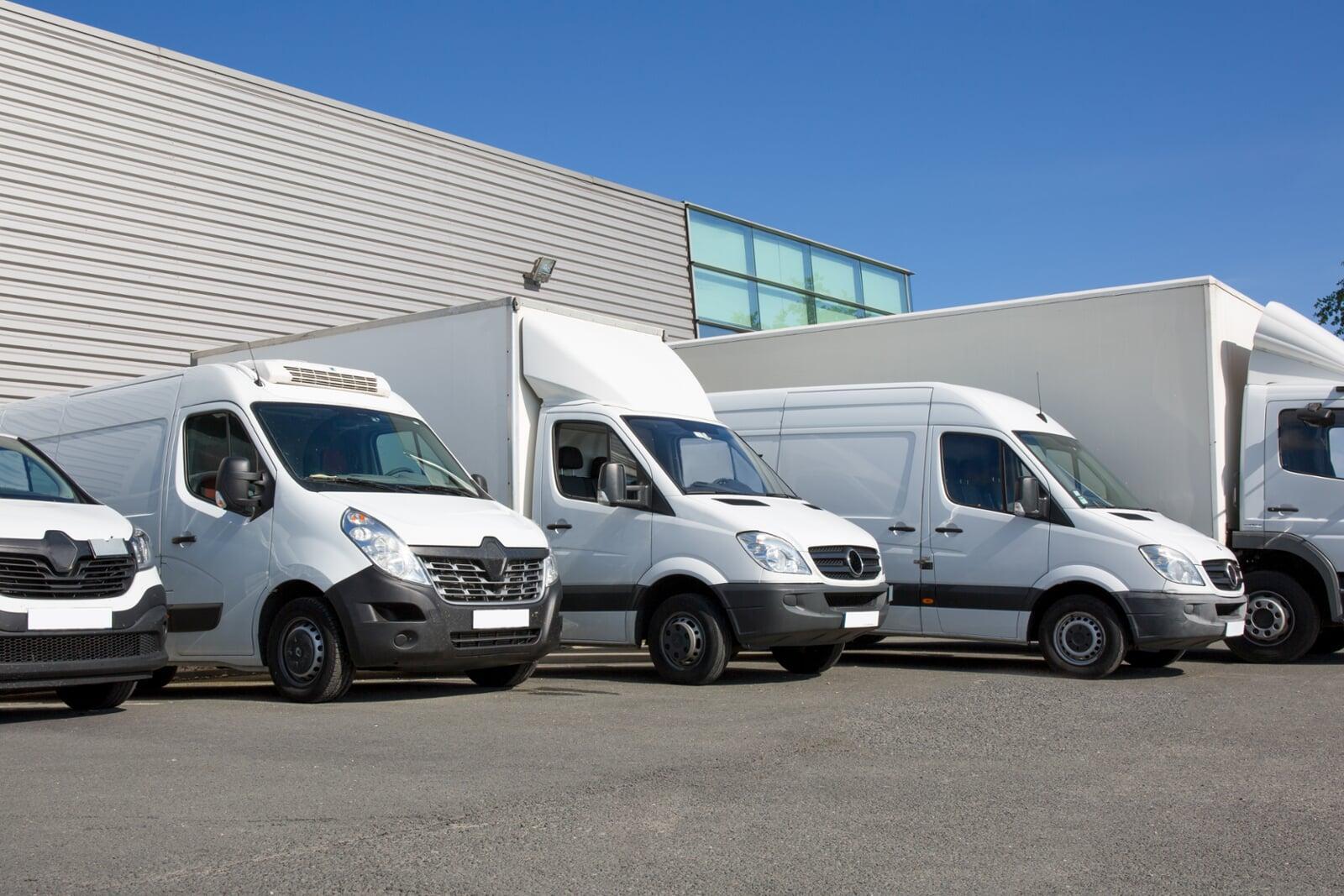 a wide angle photo of a fleet of vans and trucks