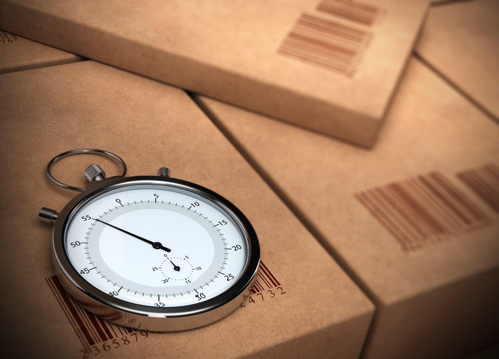 A stopwatch on top of urgent parcels