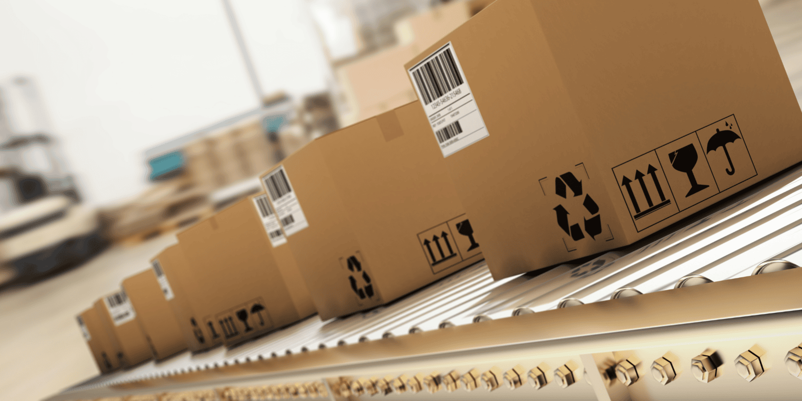 Parcels with barcode shipping labels  on a conveyor belt, in black and white.  A forklift is blurred out in the background